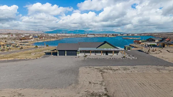 a view of a city street with car parked