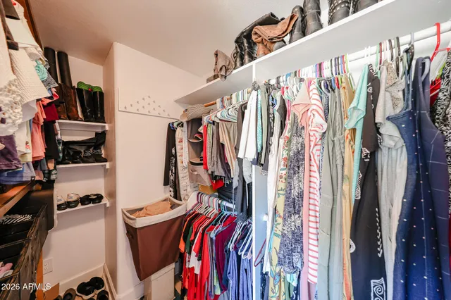 a bathroom with a granite countertop sink a toilet and a shower