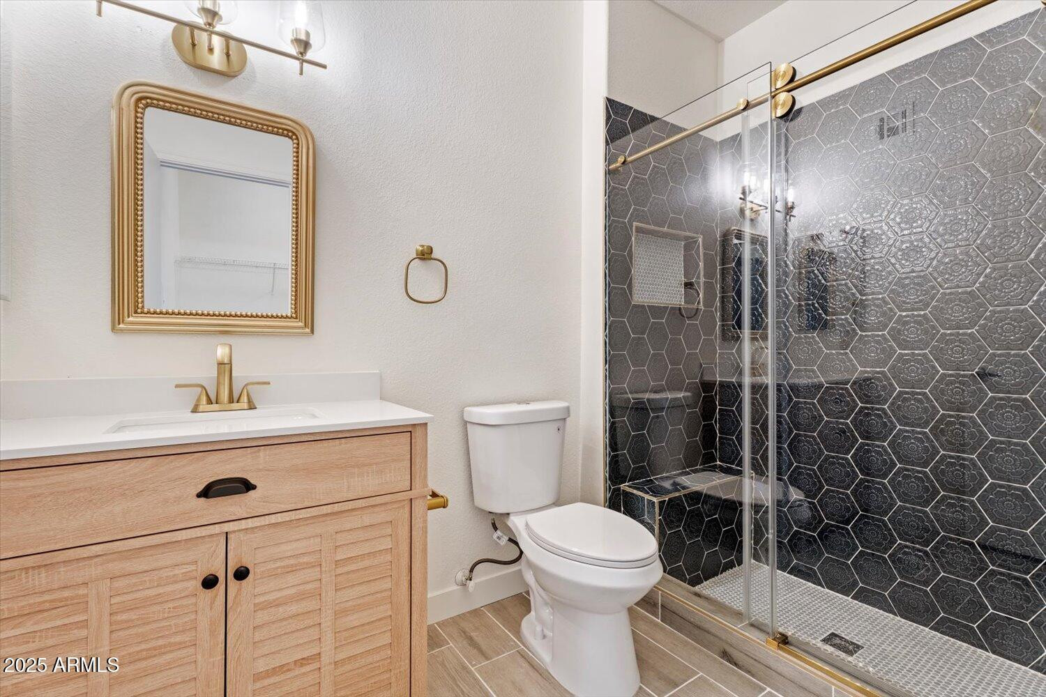 3434 East Baseline Road, Unit 260 Phoenix, AZ 85042 - Photo 13 of 19 a bathroom with a toilet sink vanity and mirror