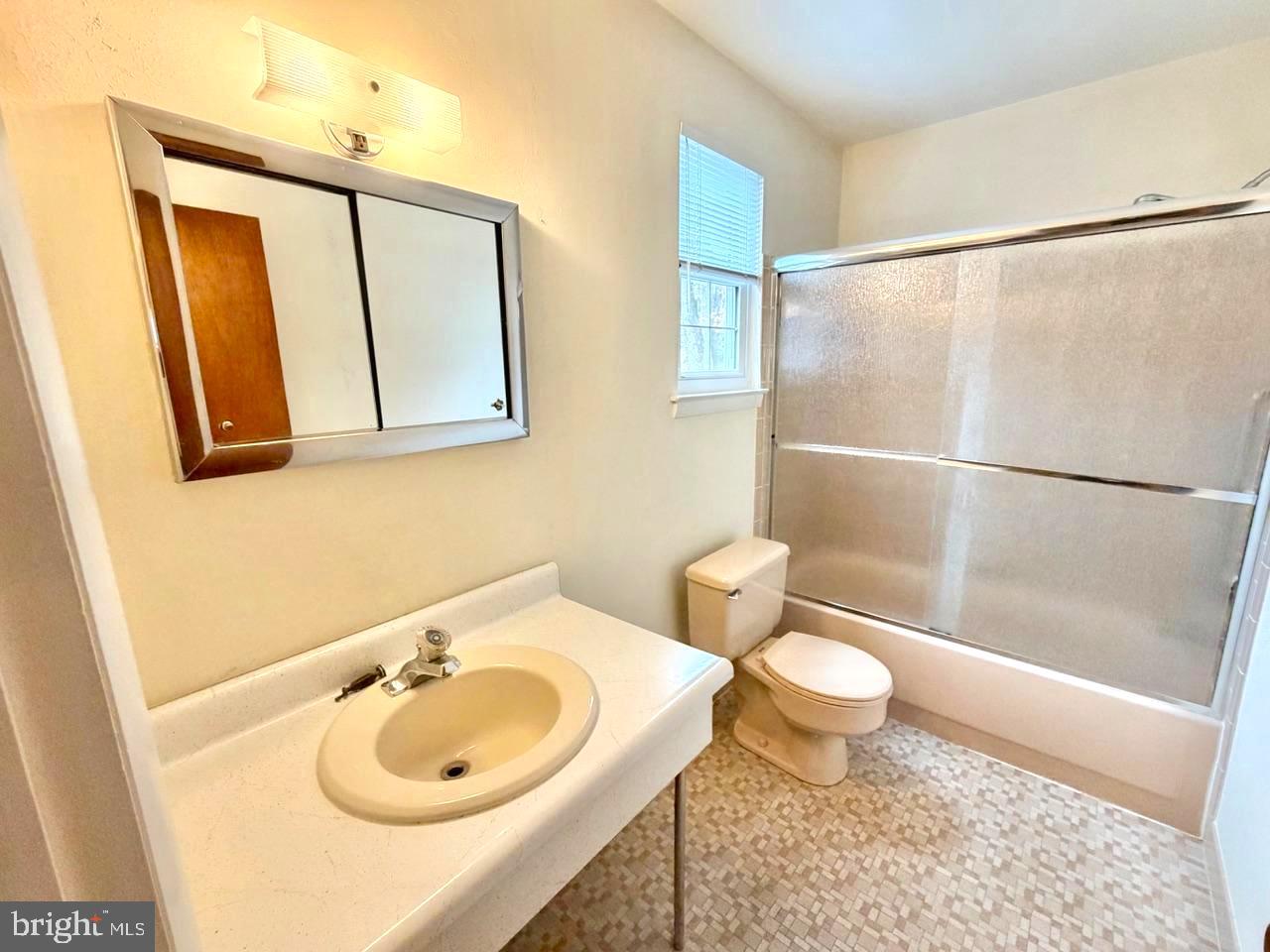 302 Provincetown Road Cherry Hill, NJ 08034 - Photo 19 of 30 a bathroom with a sink toilet and a mirror