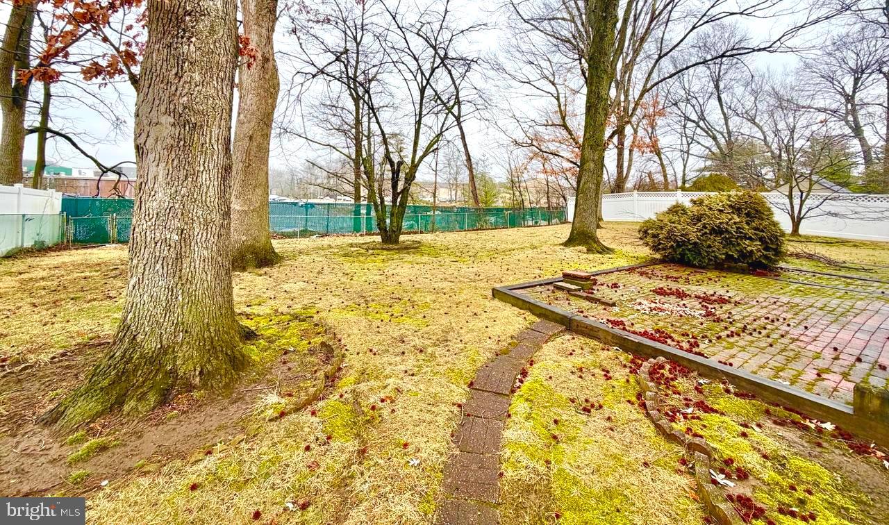302 Provincetown Road Cherry Hill, NJ 08034 - Photo 28 of 30 a view of a yard with snow on the road