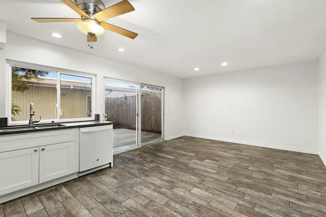 a large bathroom with a sink a mirror and a shower