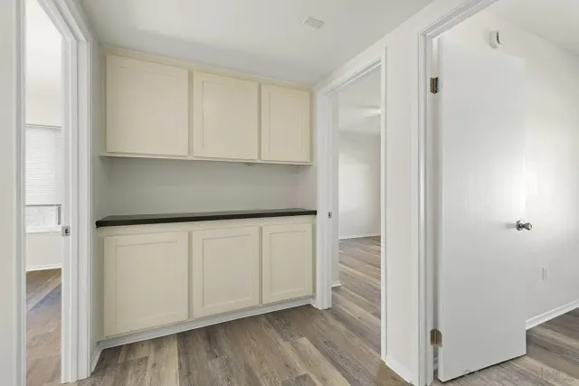 a view of cabinets and wooden floor
