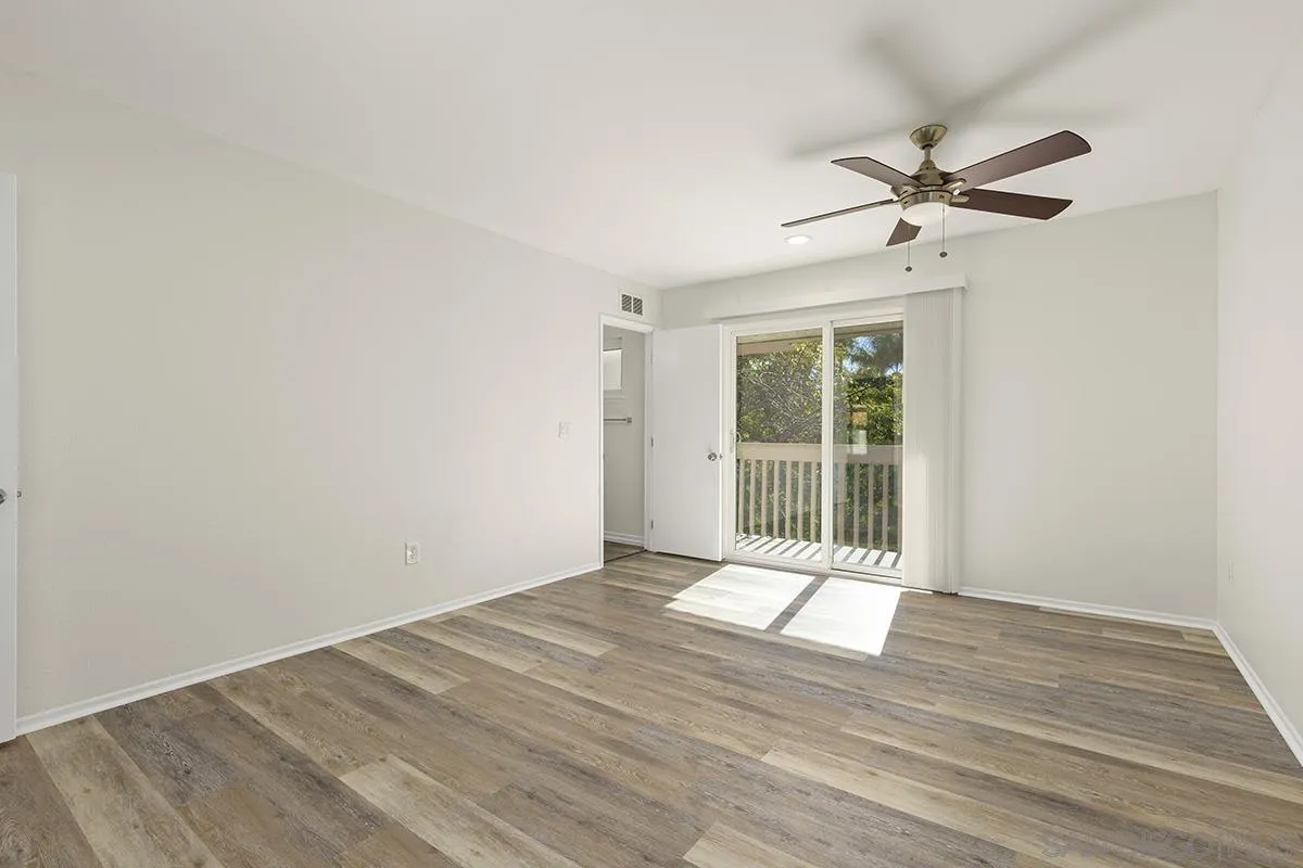 2511 Via Sorbete Carlsbad, CA 92010 - Photo 20 of 37 a view of an empty room with wooden floor and a window