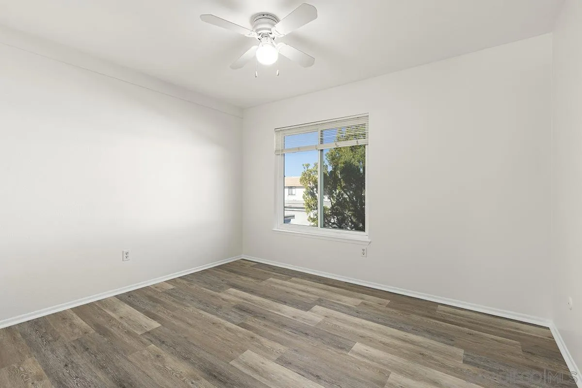 2511 Via Sorbete Carlsbad, CA 92010 - Photo 22 of 37 an empty room with wooden floor and windows