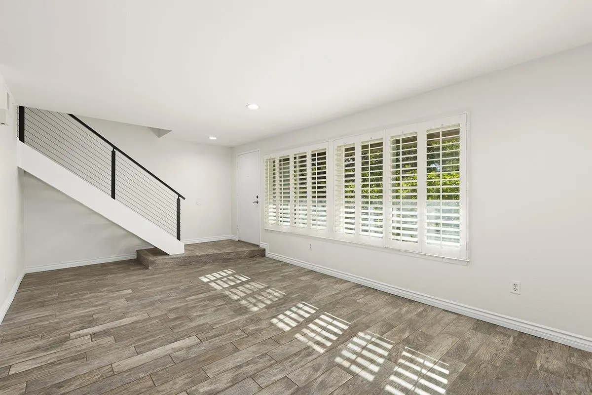 2511 Via Sorbete Carlsbad, CA 92010 - Photo 3 of 37 a view of an empty room with wooden floor and a window