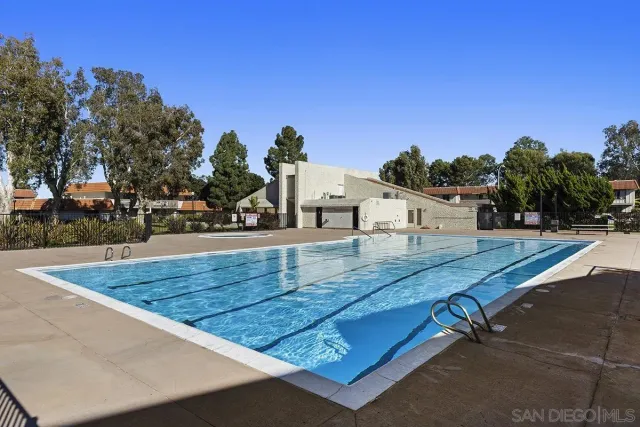 a view of a swimming pool with a patio