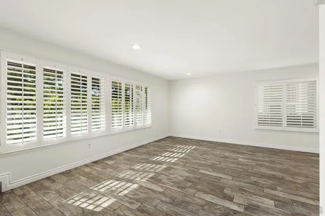 a view of an empty room with a window