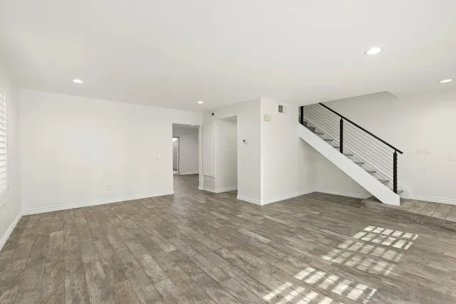 a view of an empty room with stairs