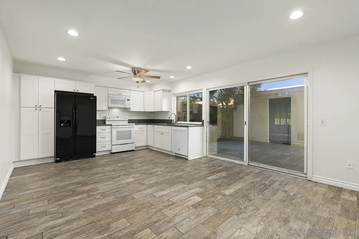 2511 Via Sorbete Carlsbad, CA 92010 - Photo 10 of 37 a large kitchen with a refrigerator and a stove top oven