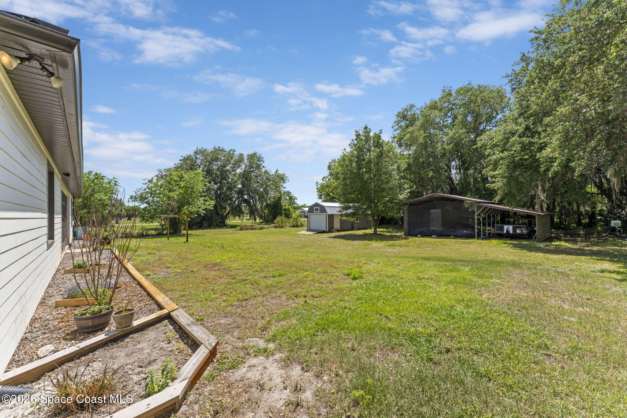 1740 Ford Road Mims, FL 32754 - Photo 38 of 43 a view of a swimming pool with a patio