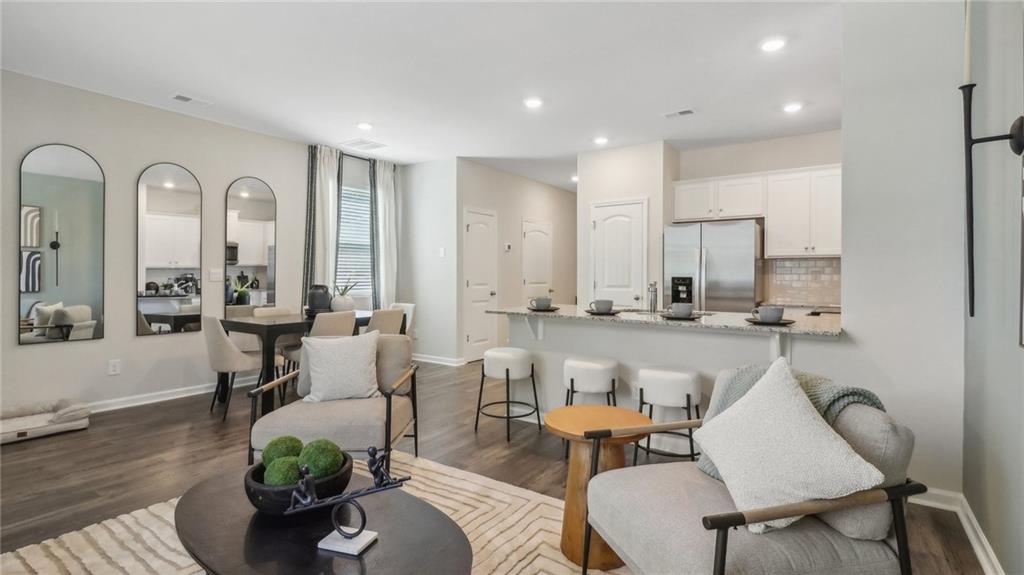 2098 Moss Hill Road Stone Mountain, GA 30083 - Photo 18 of 40 a living room with furniture kitchen view and a potted plant
