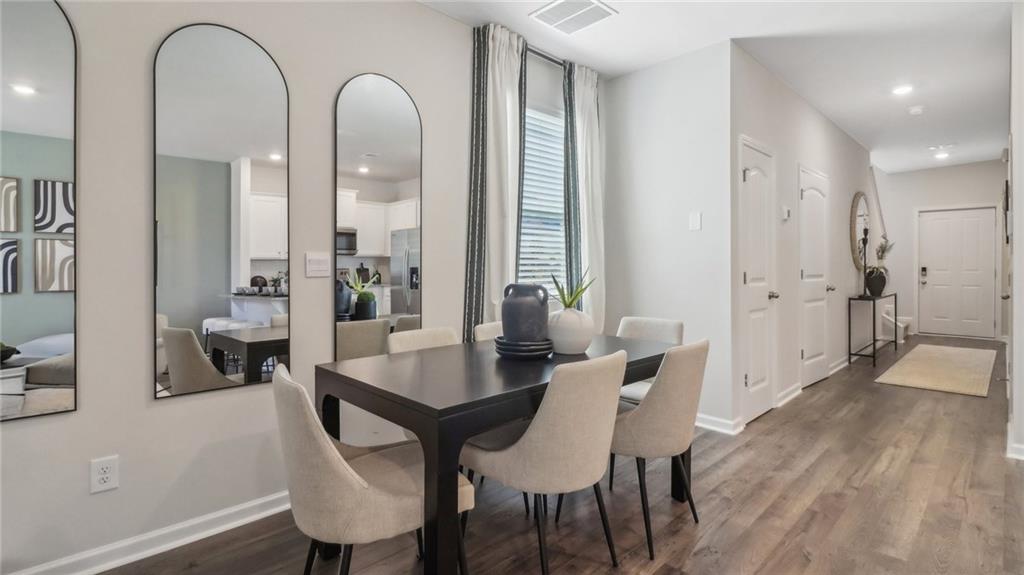 2098 Moss Hill Road Stone Mountain, GA 30083 - Photo 21 of 40 a view of a a dining room with furniture window and wooden floor