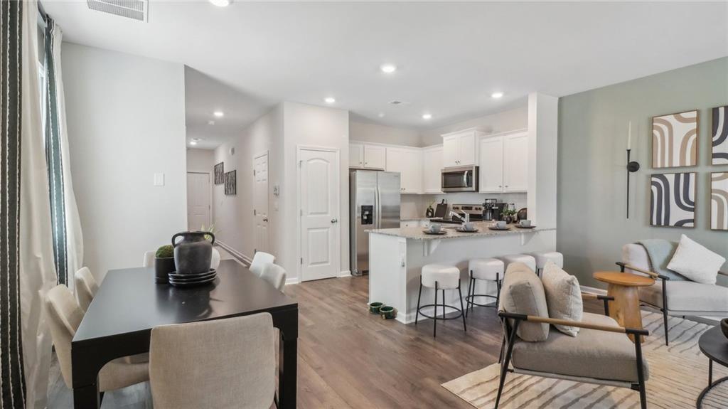 2098 Moss Hill Road Stone Mountain, GA 30083 - Photo 22 of 40 a living room with furniture and a table