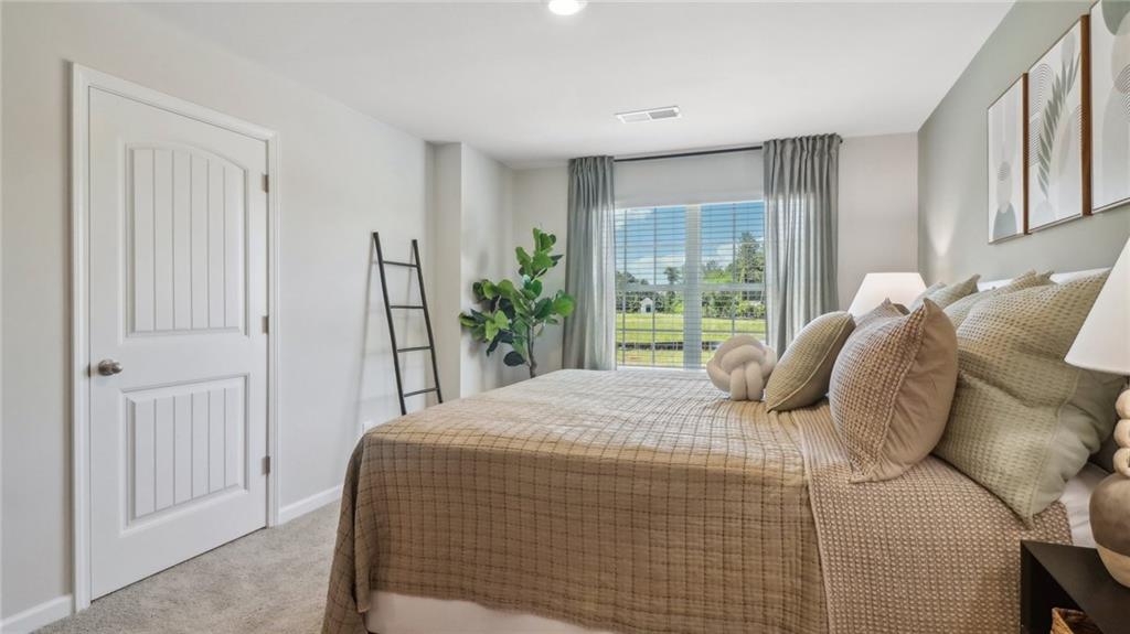 2098 Moss Hill Road Stone Mountain, GA 30083 - Photo 26 of 40 a bedroom with a bed and a window