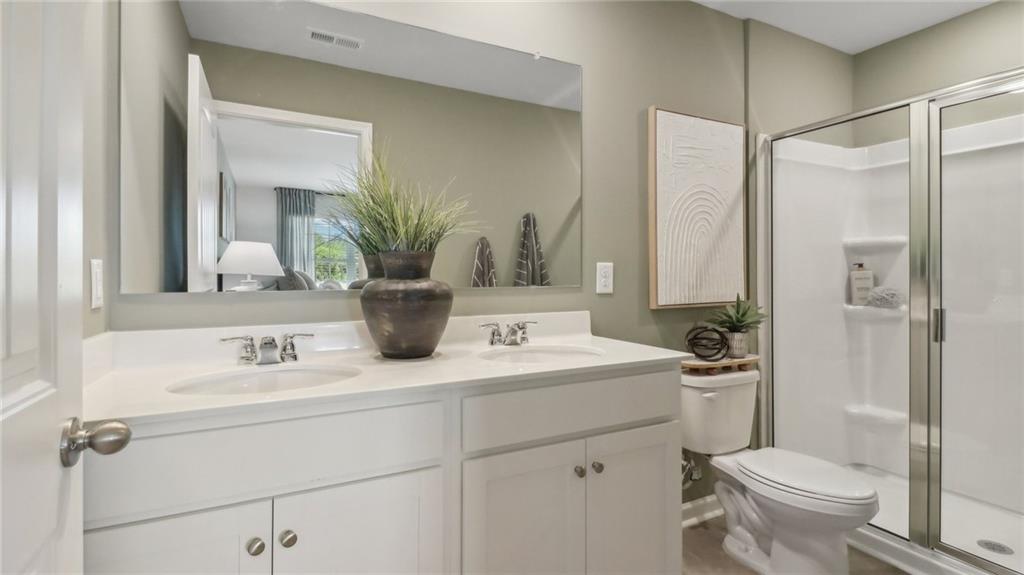 2098 Moss Hill Road Stone Mountain, GA 30083 - Photo 28 of 40 a bathroom with a sink toilet and shower