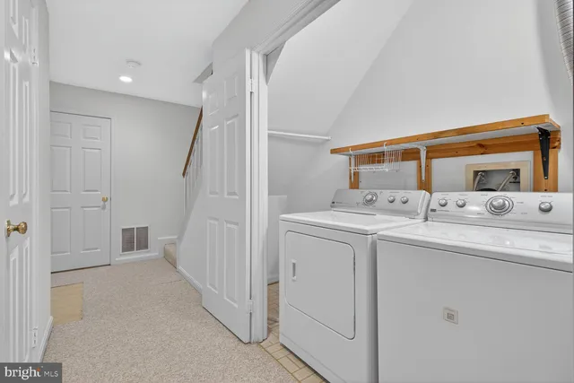 a bathroom with a double vanity sink and mirror