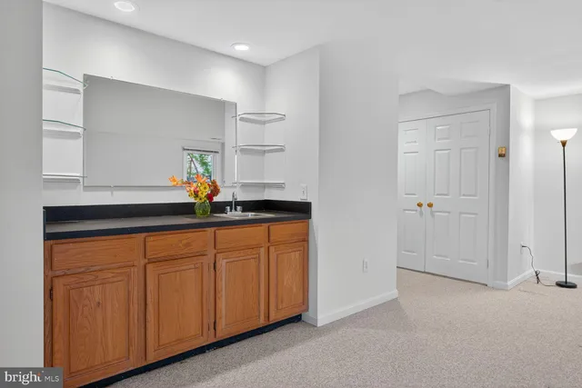 a kitchen with white cabinets