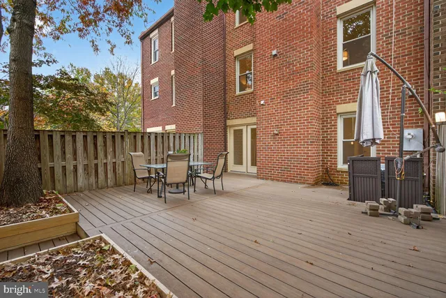 a view of a patio with a table and chairs