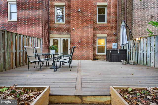 a view of a chairs and a table in the patio