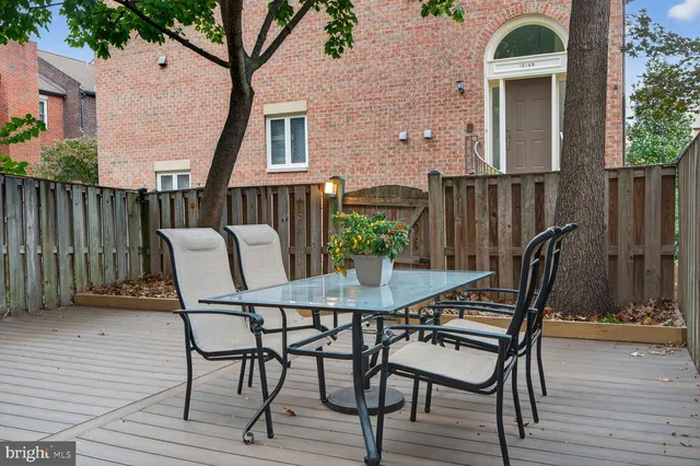 a view of a chairs and table in the patio