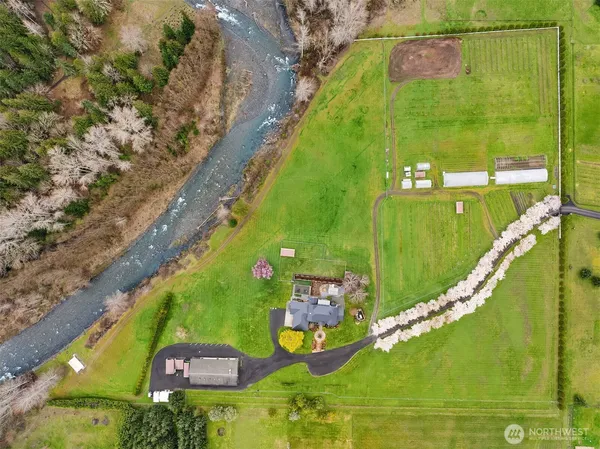 an aerial view of residential houses with outdoor space and swimming pool