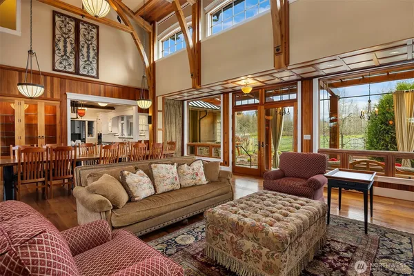 a outdoor living room with furniture and a large window