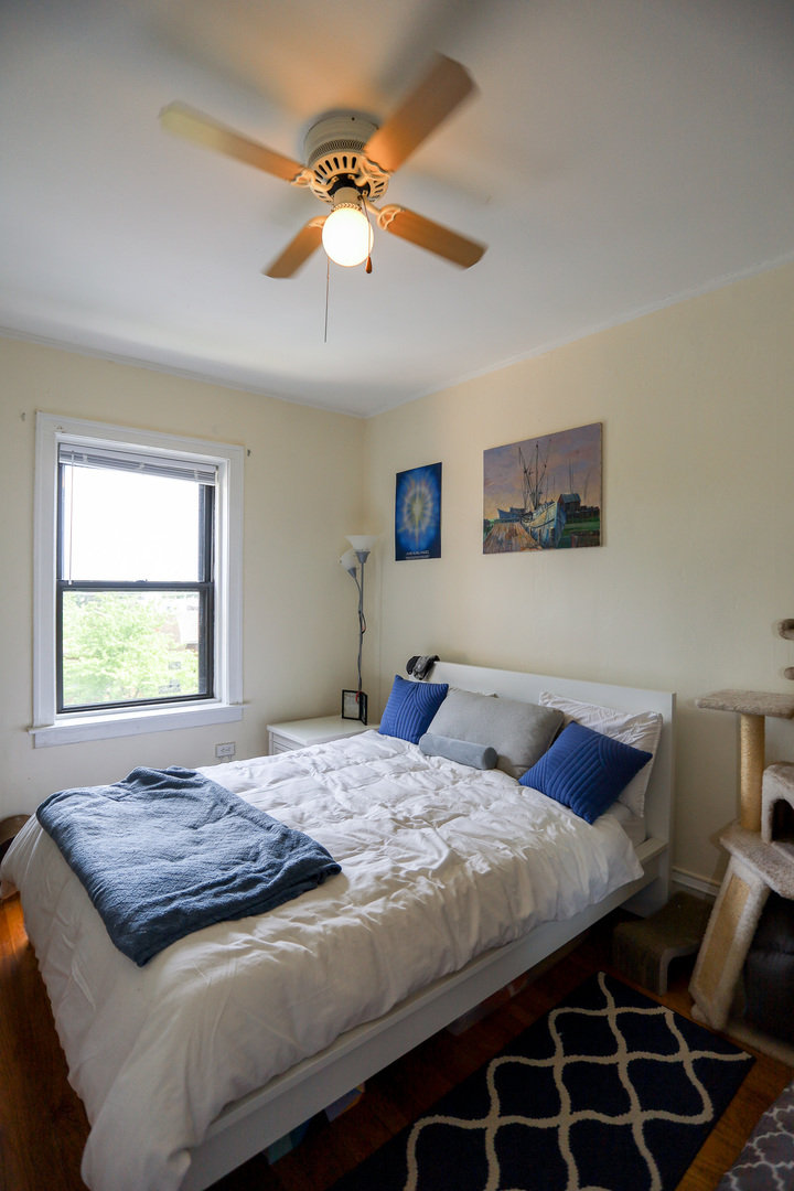 2325 West Addison Street, Unit 3 Chicago, IL 60618 - Photo 8 of 12 a bedroom with a bed and window