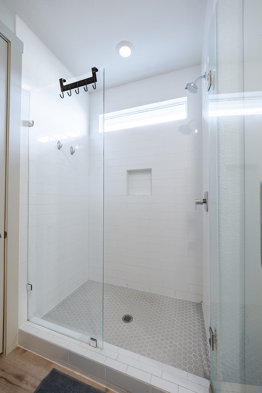 900 Balsora Cove Georgetown, TX 78628 - Photo 13 of 39 A well-appointed shower stall features clean white subway tiles and a practical recessed niche.