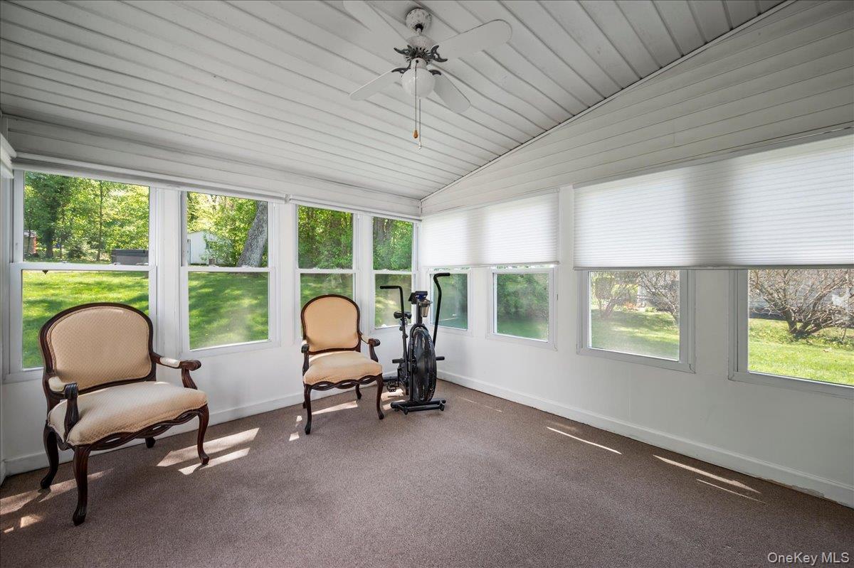 147 Lockwood Road Cortlandt Manor, NY 10567 - Photo 12 of 31 a living room with furniture and a window