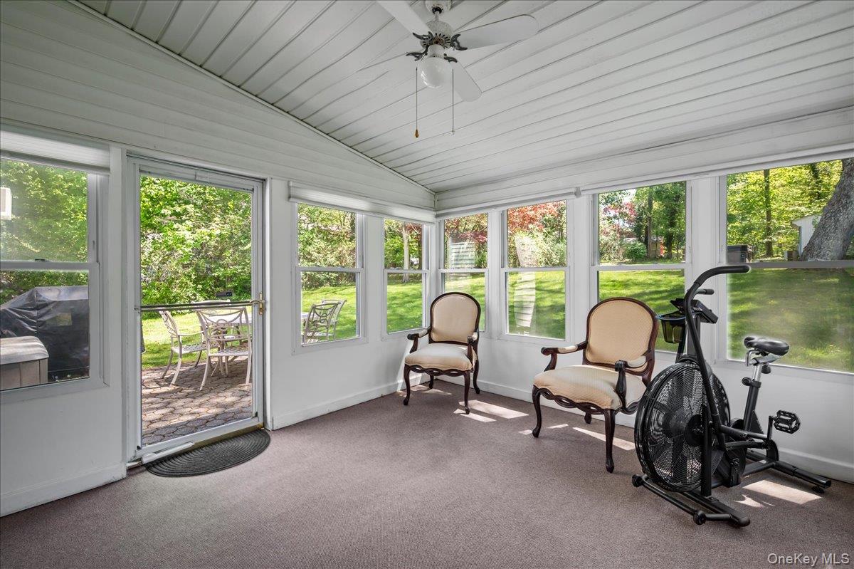 147 Lockwood Road Cortlandt Manor, NY 10567 - Photo 13 of 31 a living room with furniture and floor to ceiling windows