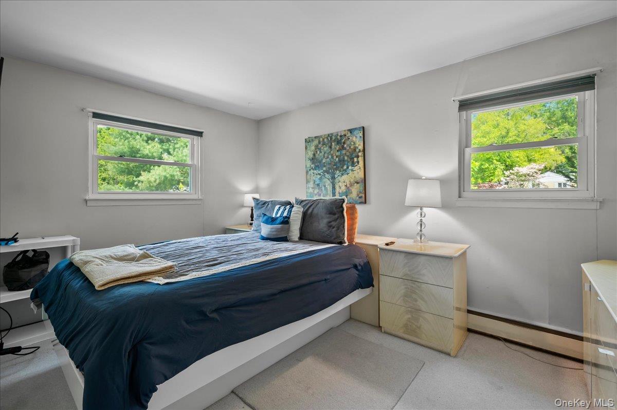 147 Lockwood Road Cortlandt Manor, NY 10567 - Photo 15 of 31 a bedroom with a bed and a window