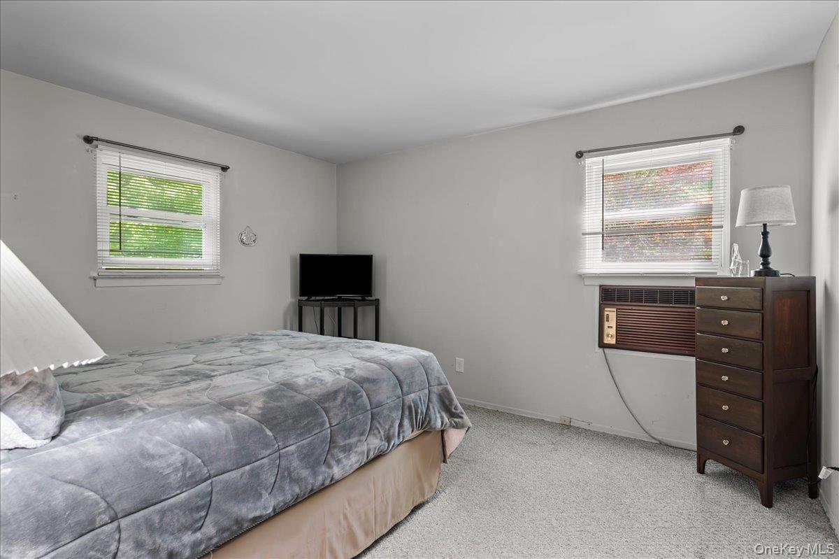 147 Lockwood Road Cortlandt Manor, NY 10567 - Photo 17 of 31 a bedroom with a bed and a window
