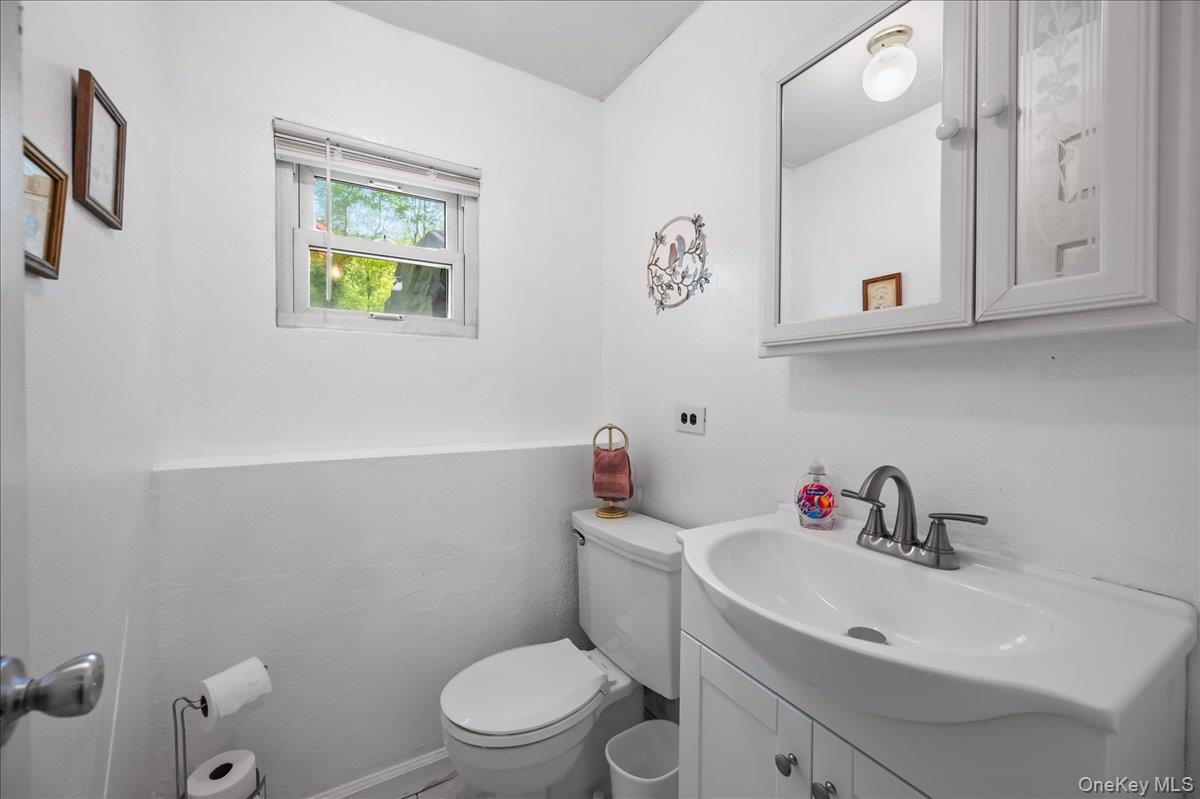 147 Lockwood Road Cortlandt Manor, NY 10567 - Photo 21 of 31 a bathroom with a sink mirror and toilet