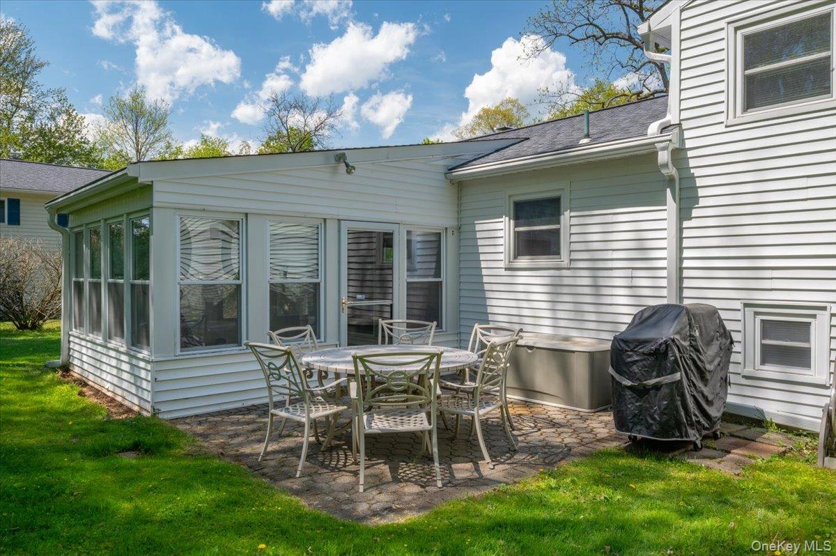 147 Lockwood Road Cortlandt Manor, NY 10567 - Photo 24 of 31 a view of a chair and table in backyard of the house