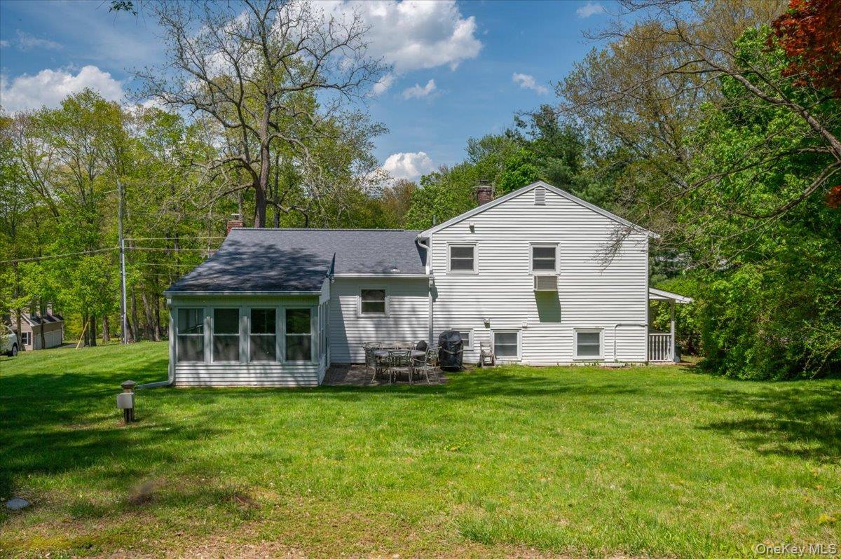 147 Lockwood Road Cortlandt Manor, NY 10567 - Photo 25 of 31 a front view of house with yard and green space