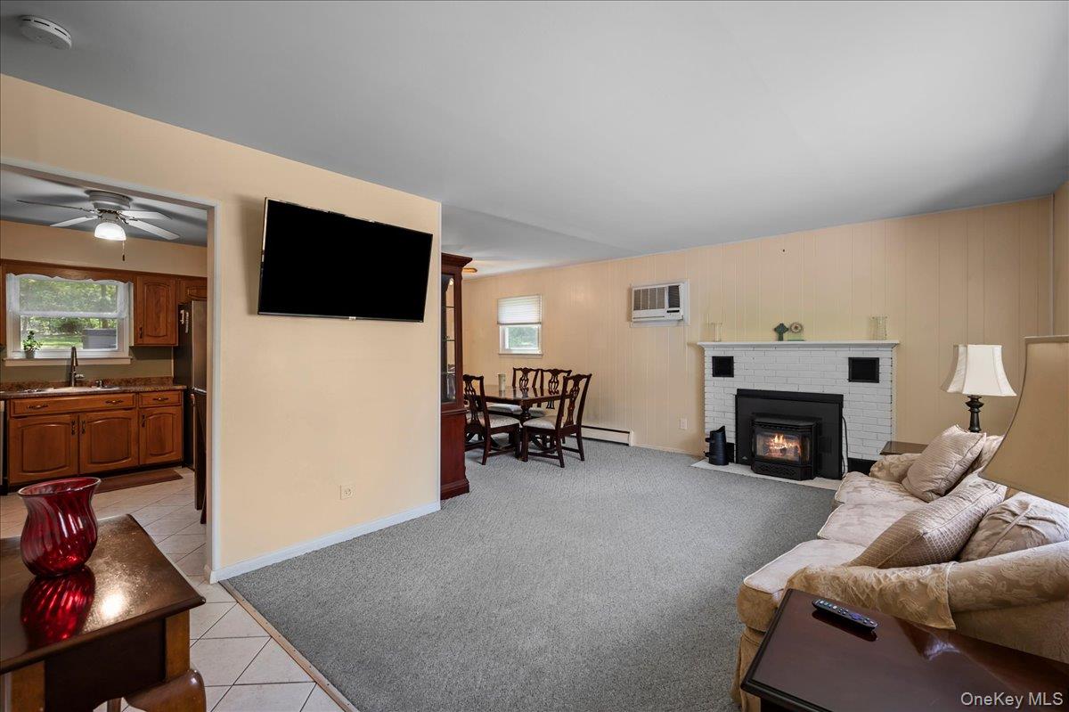 147 Lockwood Road Cortlandt Manor, NY 10567 - Photo 3 of 31 a living room with furniture and a flat screen tv