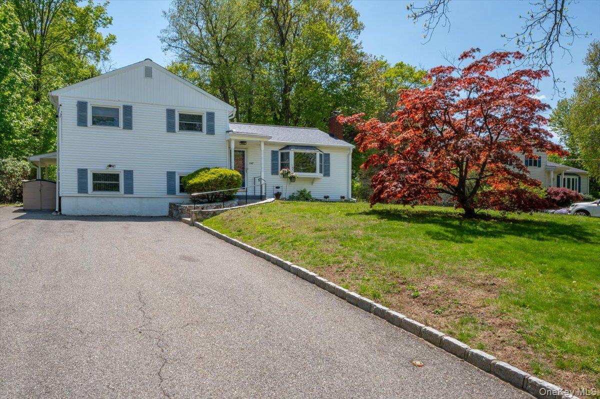 147 Lockwood Road Cortlandt Manor, NY 10567 - Photo 31 of 31 a house view with a garden space