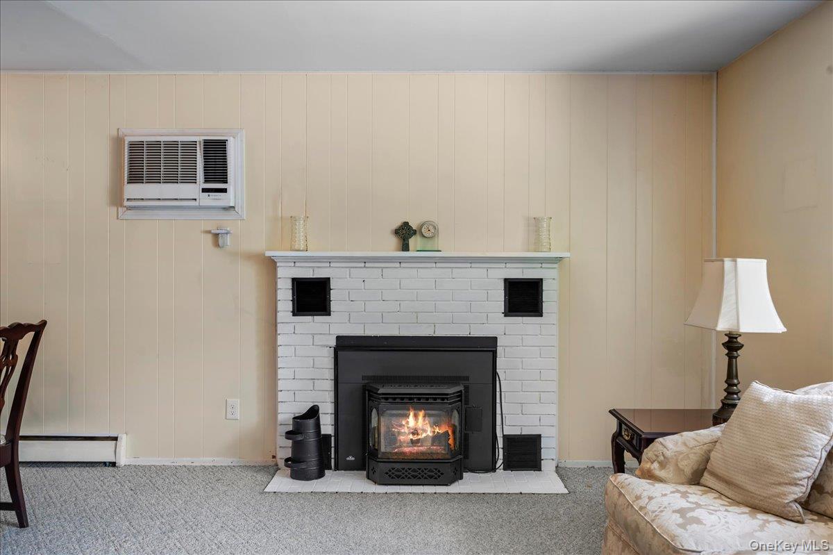147 Lockwood Road Cortlandt Manor, NY 10567 - Photo 5 of 31 a living room with furniture and a fireplace