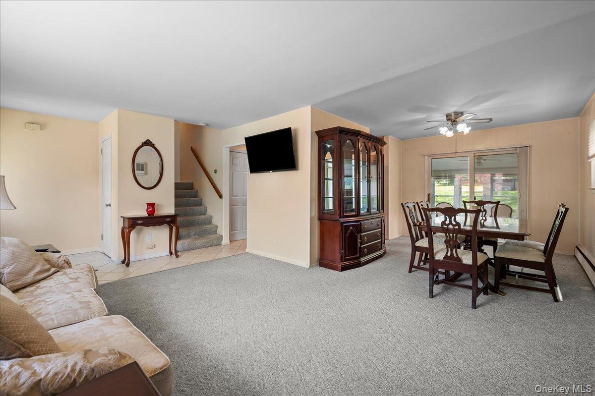 147 Lockwood Road Cortlandt Manor, NY 10567 - Photo 7 of 31 a living room with furniture and a flat screen tv
