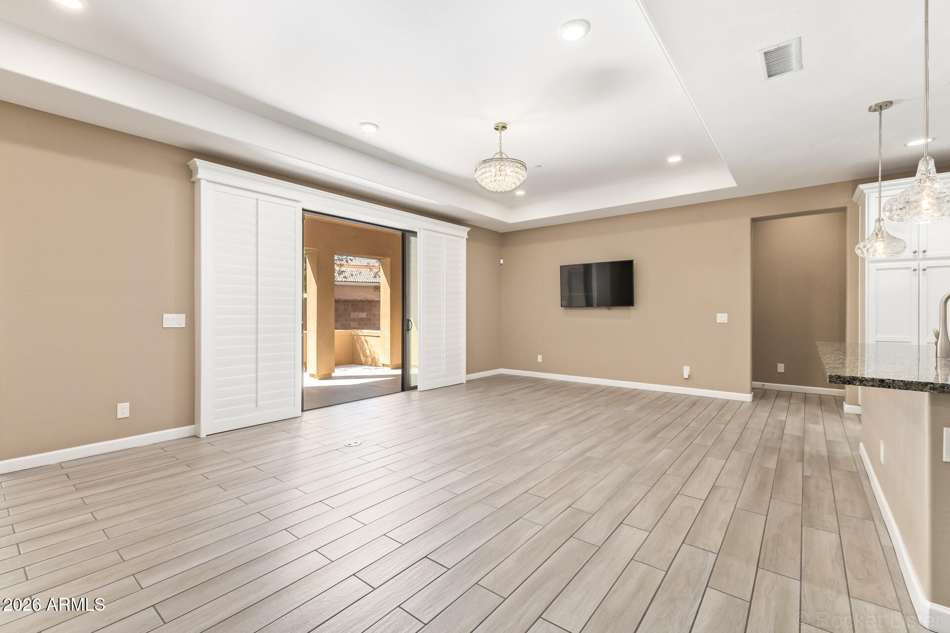 4777 South Fulton Ranch Boulevard, Unit 1068 Chandler, AZ 85248 - Photo 10 of 54 Living Room w/Shutter Panels Open