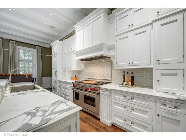a bathroom with a granite countertop sink a mirror and a shower