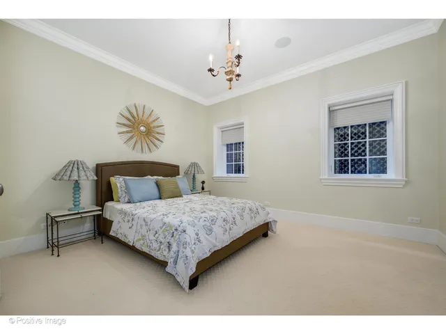 a living room with furniture a wooden floor and a large window
