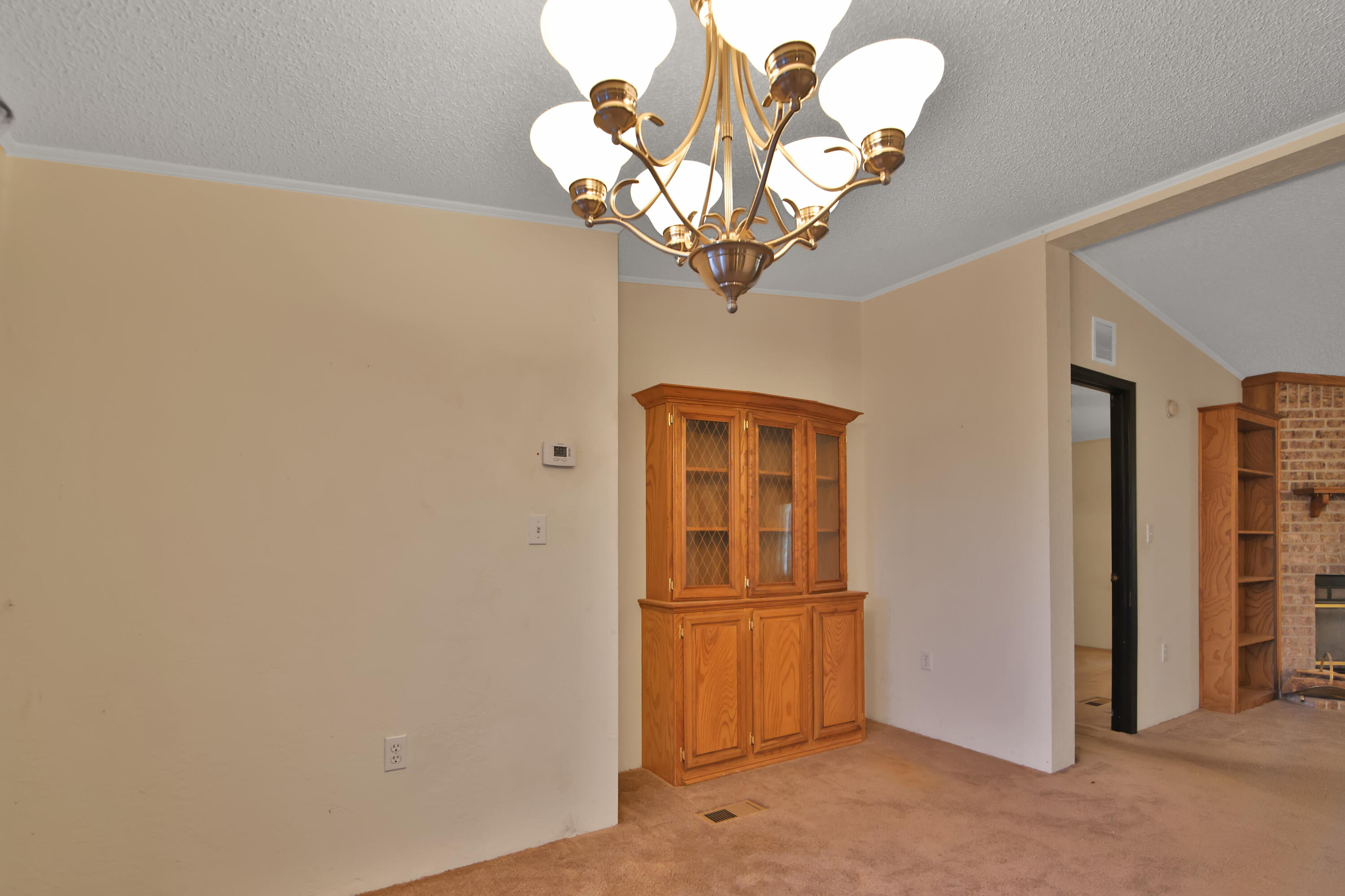 120 Highway 114 Estates Road Shallowater, TX 79363 - Photo 16 of 49 a view of a livingroom with a chandelier