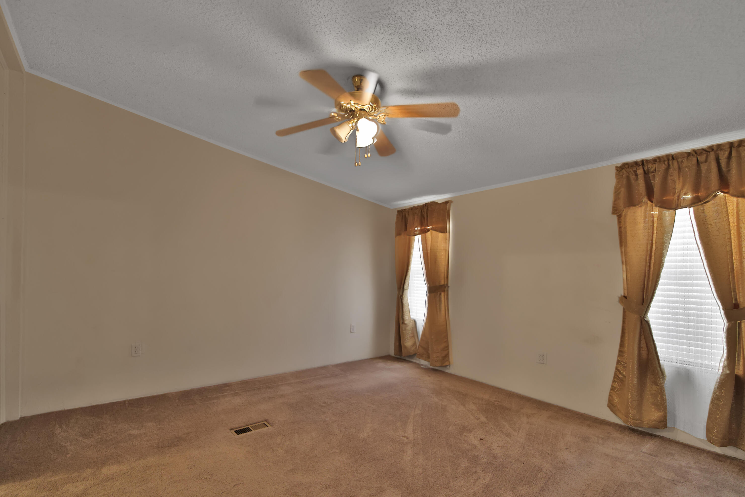 120 Highway 114 Estates Road Shallowater, TX 79363 - Photo 18 of 49 an empty room with windows and fan