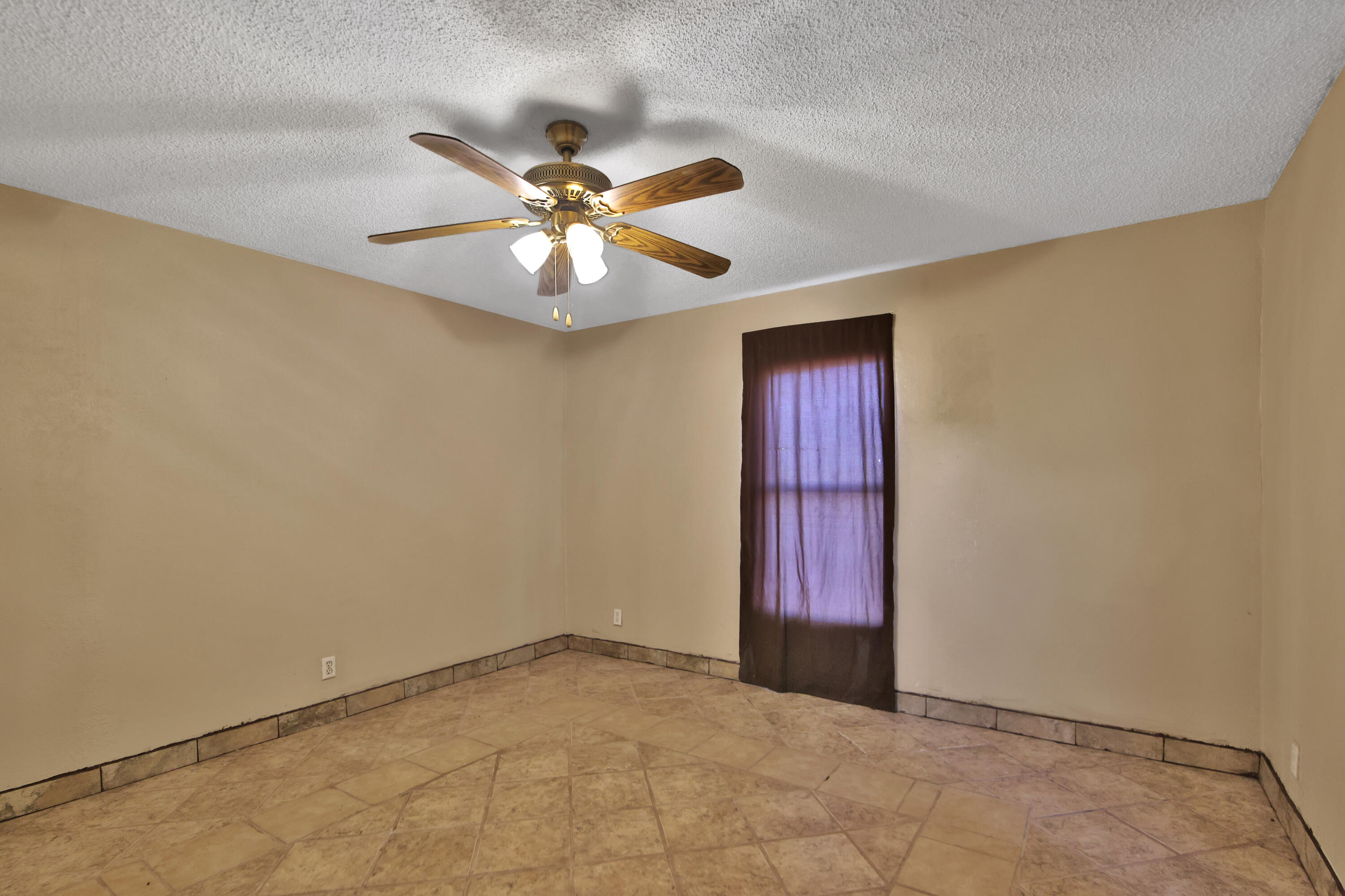120 Highway 114 Estates Road Shallowater, TX 79363 - Photo 39 of 49 an empty room with windows and fan