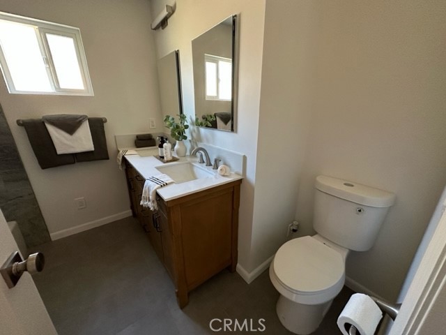 3717 Cherry Long Beach, CA 90807 - Photo 11 of 34 a bathroom with a sink toilet and mirror