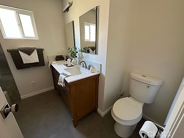 3717 Cherry Long Beach, CA 90807 - Photo 12 of 34 a bathroom with a toilet sink and mirror