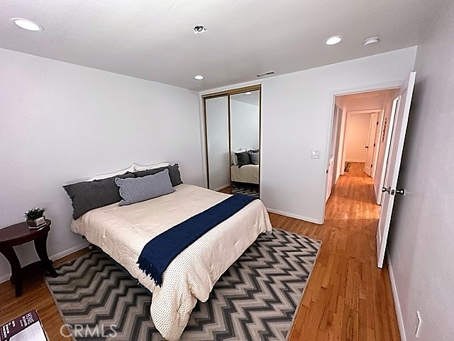 3717 Cherry Long Beach, CA 90807 - Photo 27 of 34 a bedroom with a bed and wooden floor