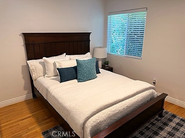 3717 Cherry Long Beach, CA 90807 - Photo 10 of 34 a bed sitting in a bedroom next to a window